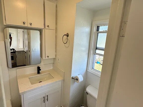 Photo - Located on a large lot, along with only four other cottage units, sits this 2 bedroom 1 bath unit