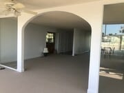 From sunroom to main entrance, wet bar, closet off front door - 8701 Delgany Ave Unit 204