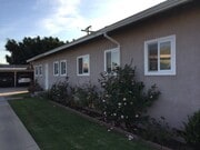 Side view of unit. Carport parking at rear of property. - 840 W 168th St Unit #B