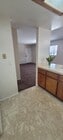 Kitchen to front room - 1571 W 207th St Unit #C