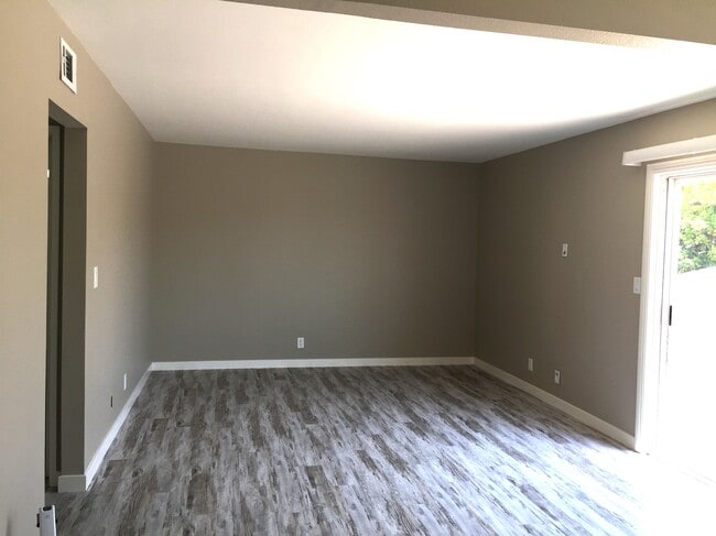Living Room, Slider to Balcony - 10678 Walnut St Unit 10678