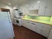Kitchen with appliances and washer/dryer in the unit. - 1755 Silver Lake Blvd Unit 1755