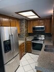 Kitchen with Stainless steel appliances - 200 Elm Ave Unit #7
