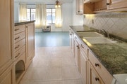 Custom kitchen cabinetry and granite counters - 250 Linden Ave Condo Unit 208