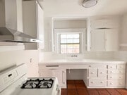 Freshly painted kitchen and polished tile floors. - 1817 E 8th St