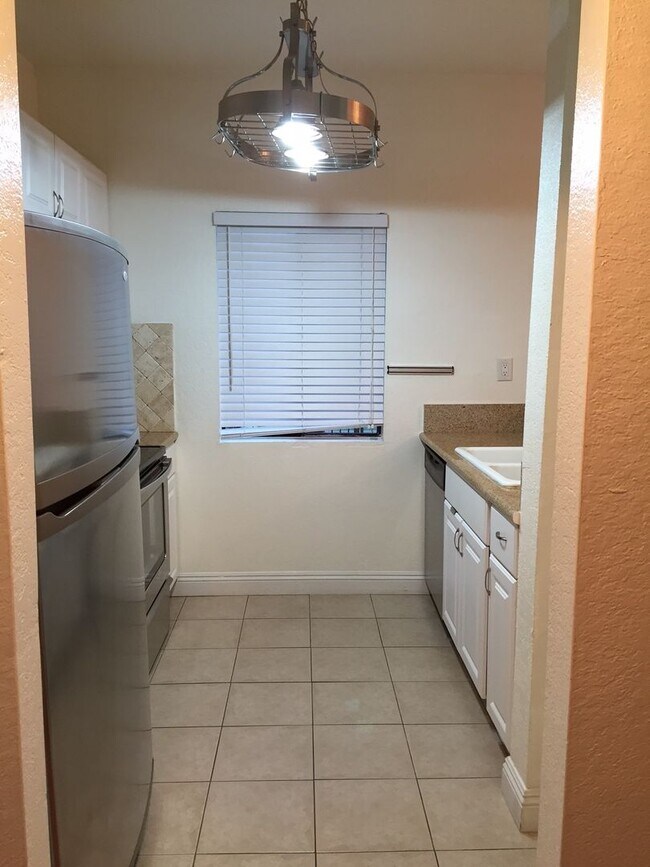 Photo - Beautiful 1 Bed/1 Bath Condo Apartment with Patio, Hardwood Flooring, Central AC, Washer and Drye...