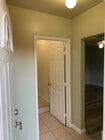 Entrance to the studio, the bathroom on the left and entrance to the bedroom on the right - 5029 Douglas Ln House