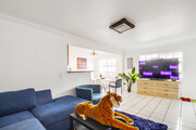 Relax in our light & airy living space, while streaming your favorite shows. - 2304 E 14th St House