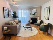 Living area with fireplace and access to 1 of 2 patios - 2474 S Centinela Ave Condo Unit Centinela  4