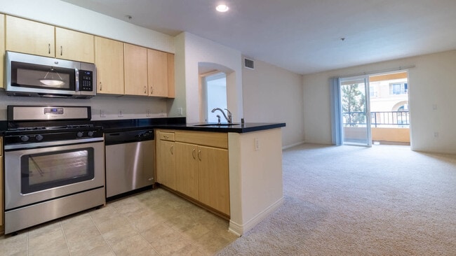 Carpeted Living Room with Balcony - Westside