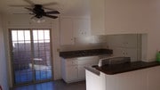 Kitchen and door to patio - 4361 Green Ave Apartments Unit B