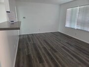 Living room with luxury vinyl plank flooring - 3455 Elm Ave