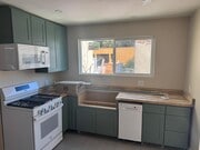 new kitchen with butcher block and a farmhouse sink. - 10821 Otsego St House