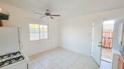 Remodeled kitchen with ceiling fan and natural light - 5527 Baileya Ave Unit A