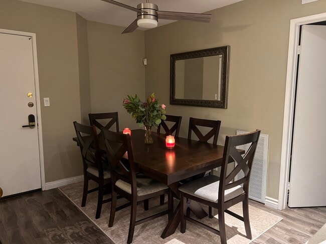 Dining room with fan and light above - 22100 Burbank Blvd Unit 333