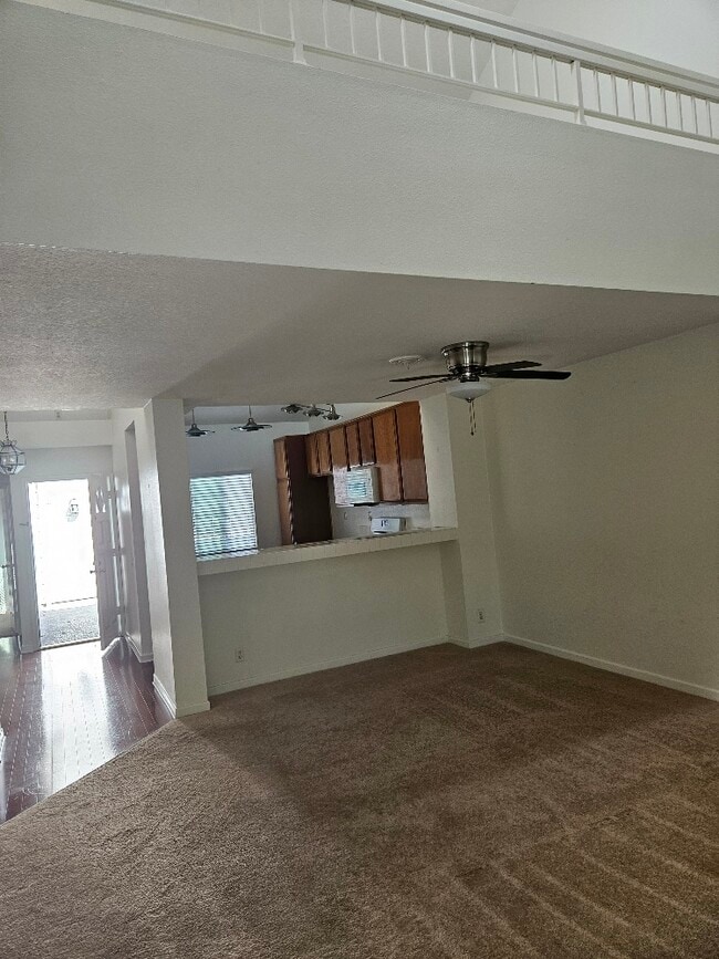 from living room to kitchen and entry - 7532 Seaspring Dr Unit 204