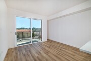 Airy open layouts flow seamlessly to private outdoor balconies, perfect for relaxing in the CA sun. - textur Apartments