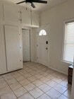 view of kitchenette looking towards entry and door to bdrm. - 305 Emerald St Unit 305