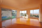 Vast Family Room with hardwood floors, and floor to ceiling view windows. - 3903 Carol Court