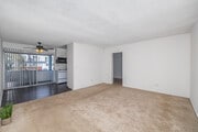 3BR, 2BA - 1,000SF - Living Room - The Grecian Terrace Apartments