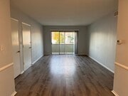 living room with balcony - 2013-2015 S Corning St Apartments