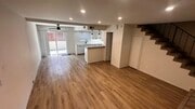 View of living room, dining room and backyard - 2424 Santa Ana Ave Townhome