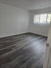 Master Bedroom with luxury vinyl plank flooring - 3455 Elm Ave Unit #215