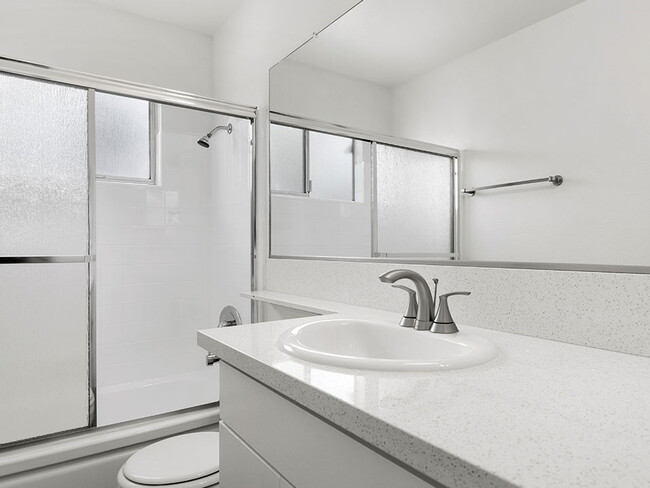 Modern styled bathroom with shower and tub. - Woodbridge Park