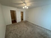 master bedroom, bathroom, and walk-in closet - 9408 Twin Trails Dr Unit 106