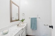 2BR, 2BA - 945SF - Primary Bathroom - Prospect Plaza Apartments