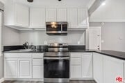 Kitchen 3 bed zoom view - NASA Living LLC Apartments
