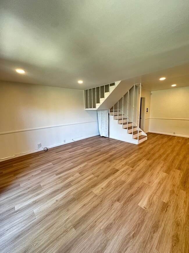 Photo - Spacious 3BR/2.5BA updated 2-story townhouse for rent with fenced patio, 2 parking spaces and more Unit A