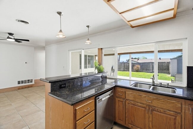 Photo - Single level, 4 bedroom, 2 bath home with 2 car garage and RV parking available now!