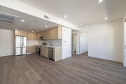 3BR, 3BA - 1224SF - Living Room - 7050 Hawthorn – Coliving + Traditional Units