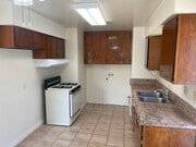 Kitchen Showing Laundry Hook-ups, Granite Counter Top and Range - 4703 W 173rd St House