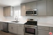 Kitchen with stainless steel appliances - 130 S Hoover St Townhome