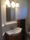 Energy and water saving bathroom with led bulbs and dual flush toilet. Plenty of storage with two corner shelves and a shelving unit - 400 East Airport Avenue