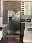 Kitchen with refrigerator with ice and water dispenser - 8530 Holloway Dr Condo Unit 426