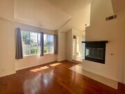 Living Room with Fireplace and Vaulted Cielings - 7102 Phelps Rd Townhome
