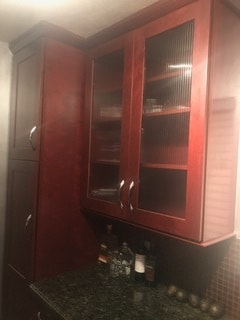 Beautiful glass panel rosewood cabinet - 1861 Pandora Ave Unit 1