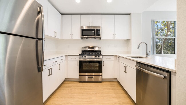 Kitchen with Stainless Steel Appliances - The Oaks