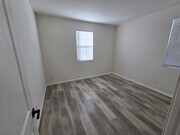 Photo - Open-Concept Living with Downstairs Bedroom & Enclosed Patio Retreat