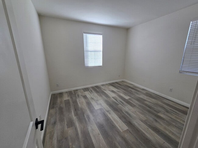 Photo - Open-Concept Living with Downstairs Bedroom & Enclosed Patio Retreat