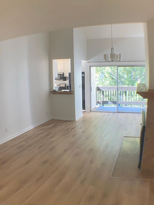 Bright living and dining areas with vaulted ceilings and private balcony - 8305 Summertime Ln Unit 8305