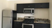 With fridge oven and microwave - 7316 White Oak Ave Apartment Unit Luxury Studio