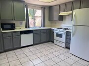 Nice kitchen with refrigerator, microwave oven dishwasher and a water dispenser - 3248 E Avenue S2 House