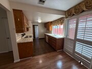 Efficient galley kitchen with abundant cabinetry and natural light - 1134 W Huntington Dr Townhome