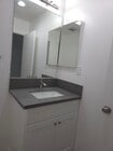 En suite 1/2 bath with quartz countertop and Shaker cabinets - 3455 Elm Ave