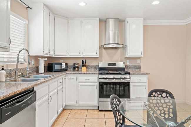 Photo - Fully Furnished 2BR Home with Crib — Mid-T...