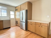 Kitchen with brand new stainless steel appliances, quartz countertops, and maple cabinets - 1041 Wilcox Ave Unit 1041